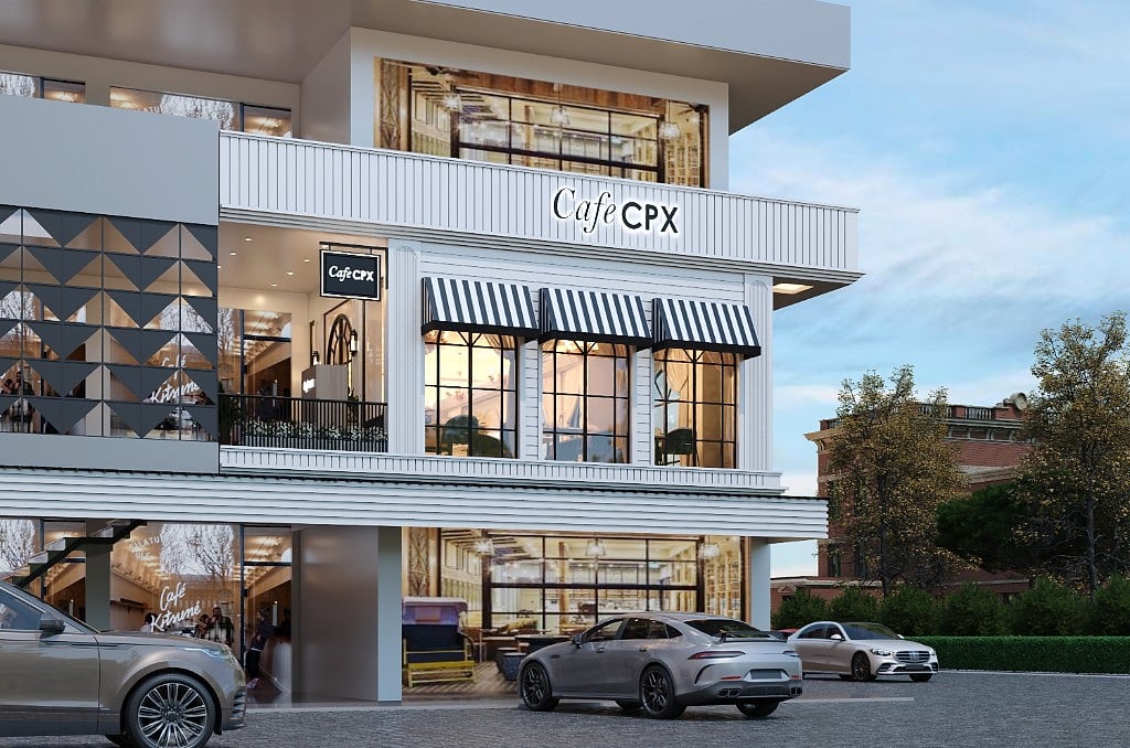 The Cafe CPX facade, a white ribbed and panelled frontage with black-and-white striped awnings, arched windows, double-height glazing and a black-and-brass Cafe CPX sign
