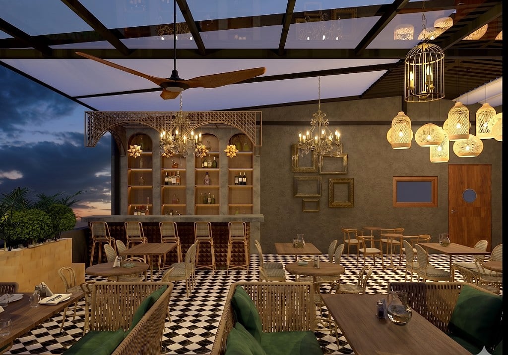 The terrace bar, a textured concrete counter with arched backlit shelving of bottles, rattan stools, crystal chandeliers, a birdcage lantern and a gold-framed gallery wall