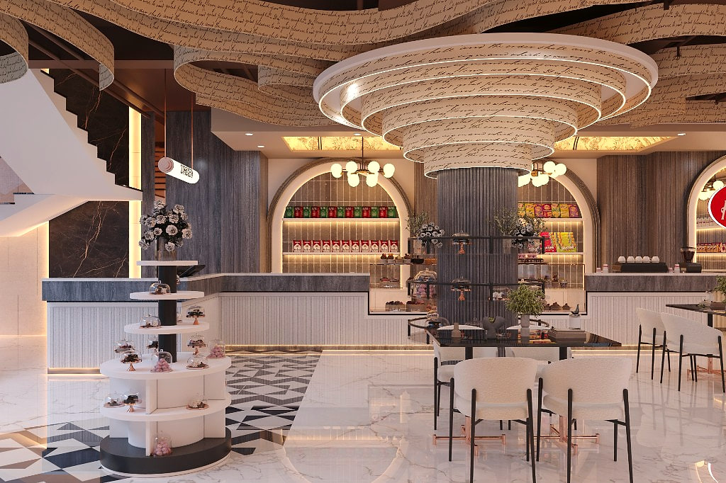 Wide view of the showroom floor with stairs, cake tower and geometric marble inlay