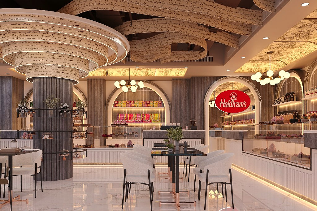 Bakery counter with the Haldiram's logo, fluted joinery and arched product niches