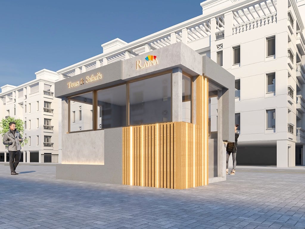A daytime corner view of the kiosk showing the warm fluted timber slat cladding with linear LED, concrete frame and full-height glazing above