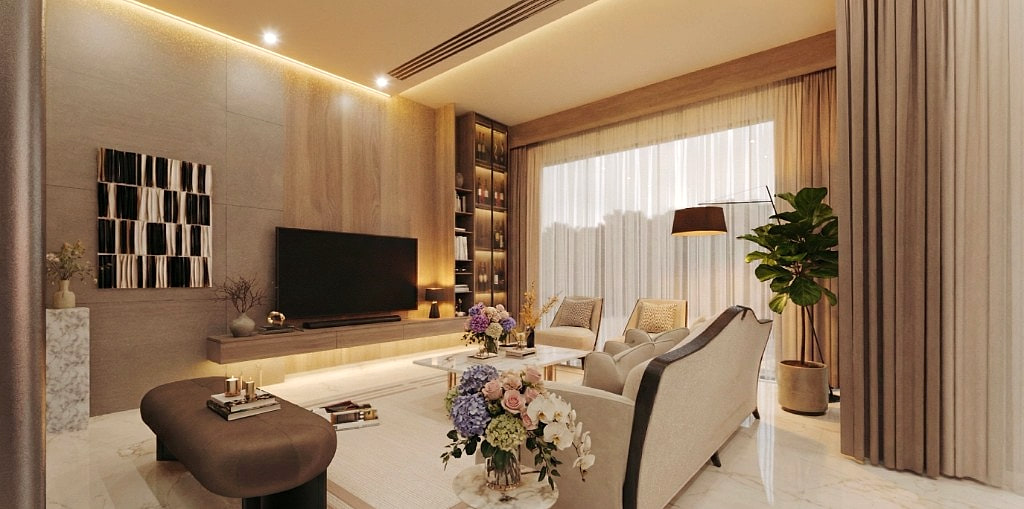Media room lounge with the brass-and-marble coffee table, cream boucle chairs and a curated arrangement of fresh flowers