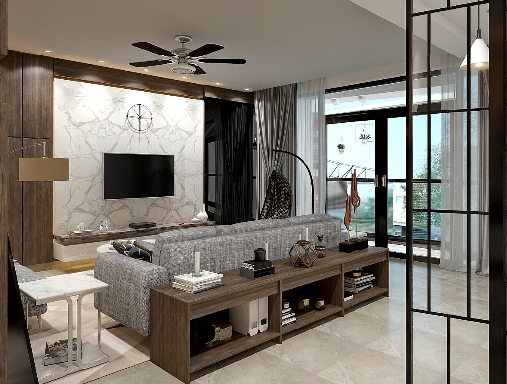A wider view of the penthouse living area, a long timber console behind the grey sofa, a black-framed glass partition and sheer-curtained balcony doors beyond