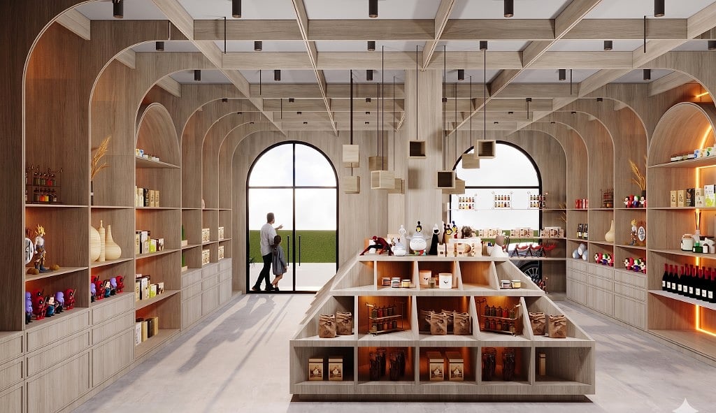 The full TinklleBox interior, arched oak shelving wrapping the room, a central stepped pyramid display and an arched glass door at the far end, lit by cube pendants