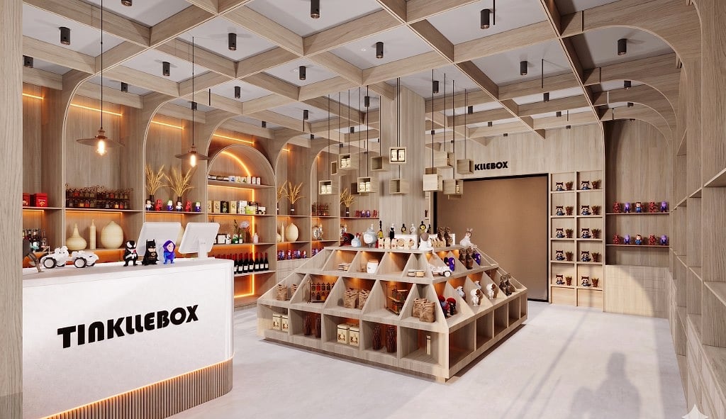 The TinklleBox interior, a white fluted counter with the logo beside a central stepped oak pyramid display, wrapped by floor-to-ceiling arched oak shelving under a coffered timber ceiling