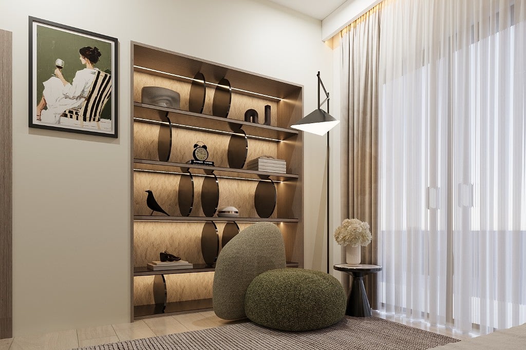 A reading corner in the master suite, a backlit display shelf with curved brass brackets, a framed print, a black floor lamp and two green boucle pouffes beside sheer-curtained windows